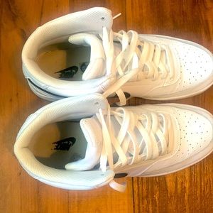 White air force one’s with black nike signs on the side!